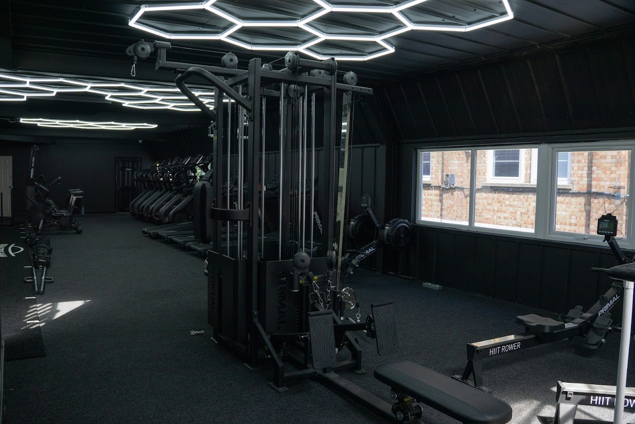 Hype Gym cardio floor with signature hexagonal LED ceiling lights and premium fitness equipment